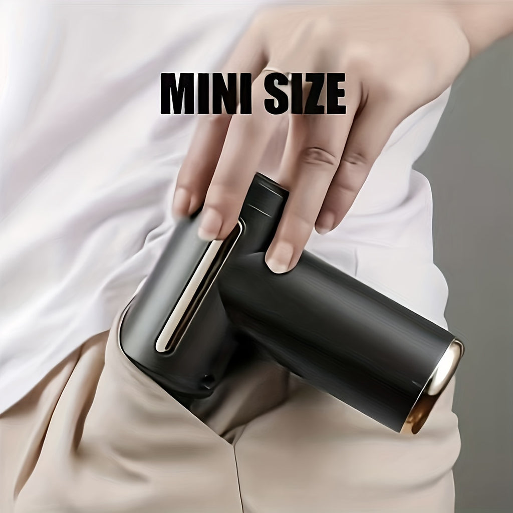 A hand puts a compact black Handheld Massage Gun, Deep Tissue Muscle Percussion Massager, into the pocket of beige pants. The words MINI SIZE appear above in bold black letters.
